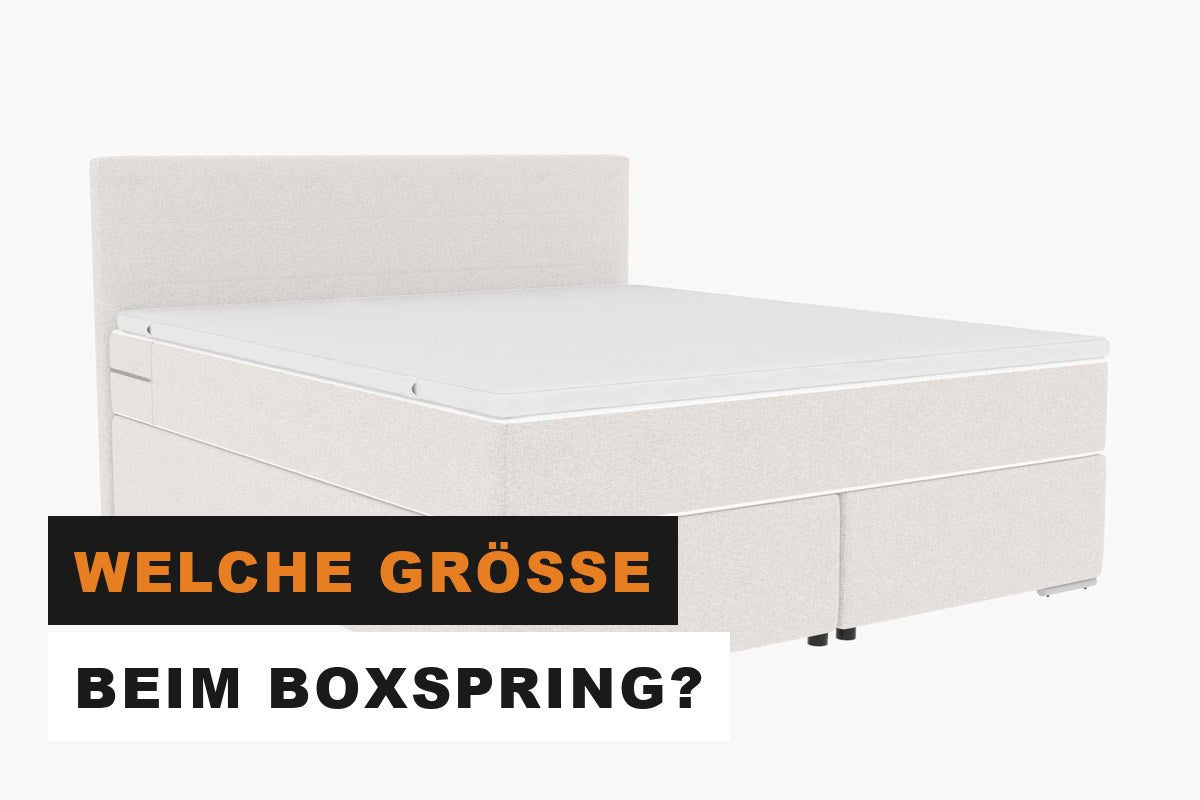 Großes Boxspringbett in Webstoff mit hohem Kopfteil im Schlafzimmer