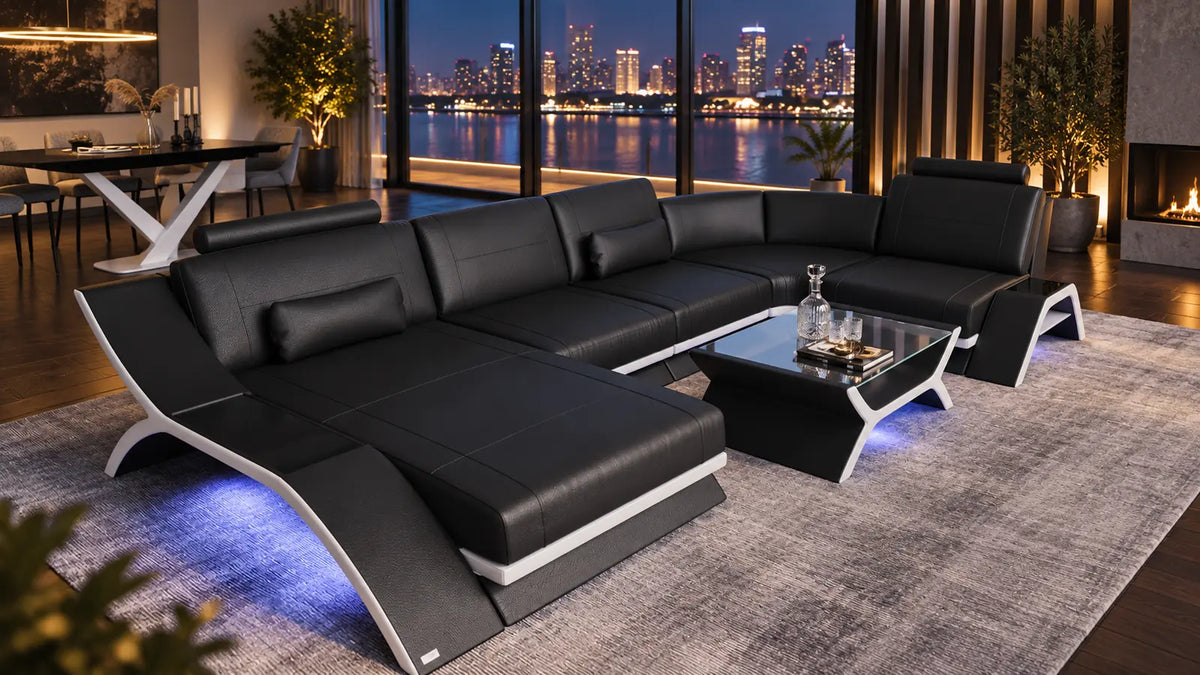 Calabria Sofas – schwarze Sofa Dreams Leder-Wohnlandschaft mit Couchtisch und Lichtakzenten