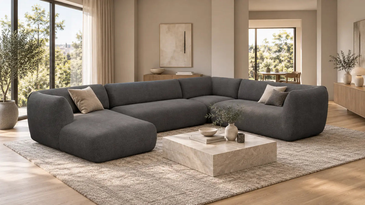 Dunkelgraue Madrid Wohnlandschaft in U-Form mit breiter Ottomane in einem modernen Wohnzimmer